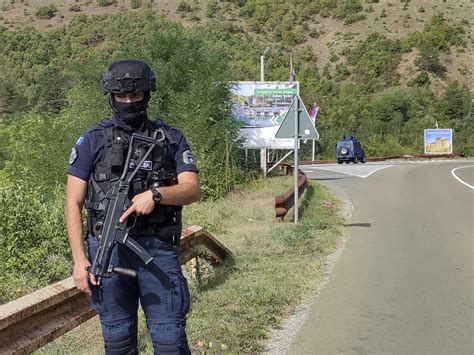1 Kosovo police officer killed and 1 wounded in an attack in the north, raising tensions with Serbia